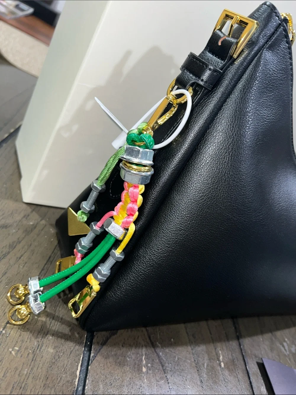 Black Leather Shoulder Bag with Gold Triangle Logo